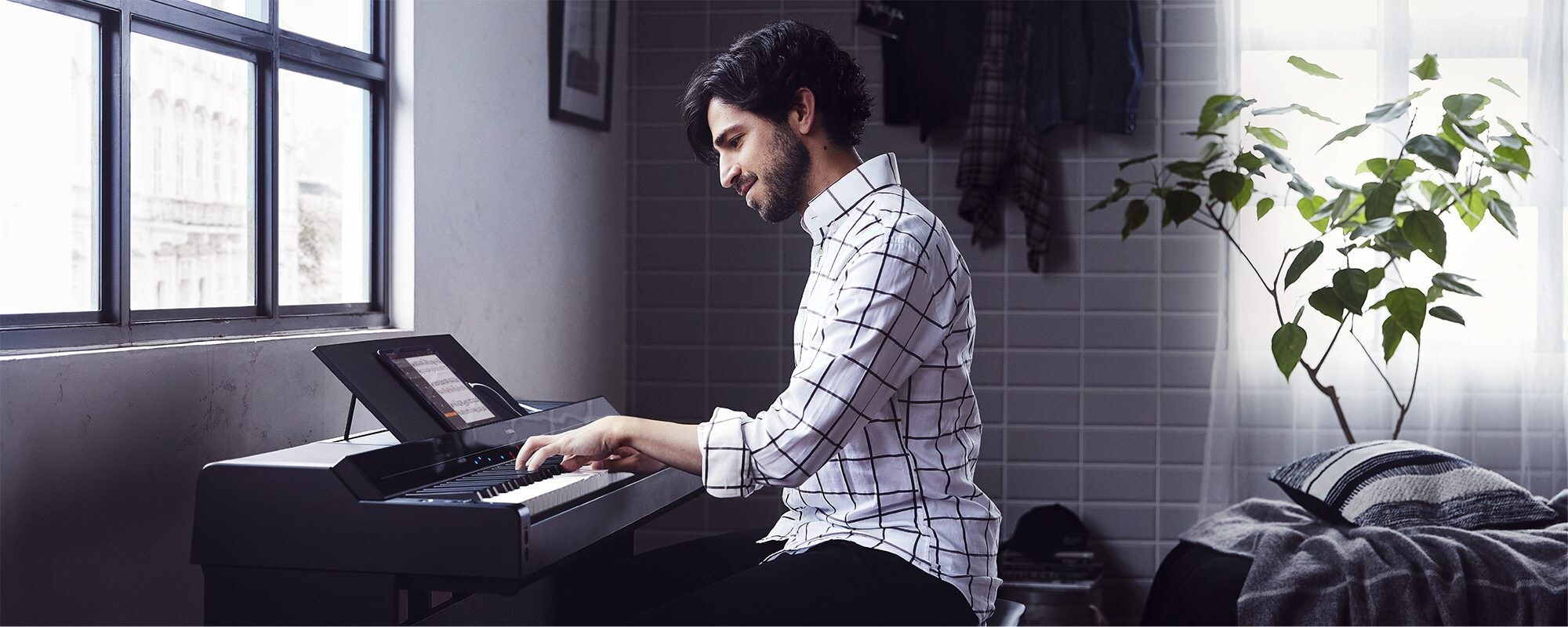 A person playing a Yamaha P-S500 Portable Digital Smart Piano